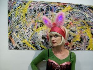 Jenessa at SeaBreeze in front of a painting by Vonder Gray (or Erik Reel?)