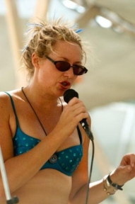 Art Predator aka Gwendolyn Alley reads in Center Camp,  Burning Man