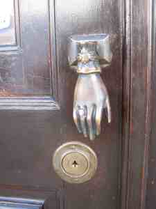 the hand that greets you on a door at the castle Monsaraz
